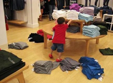 Some shitty little kid messing up a retail worker's hard work. Image via Facebook.